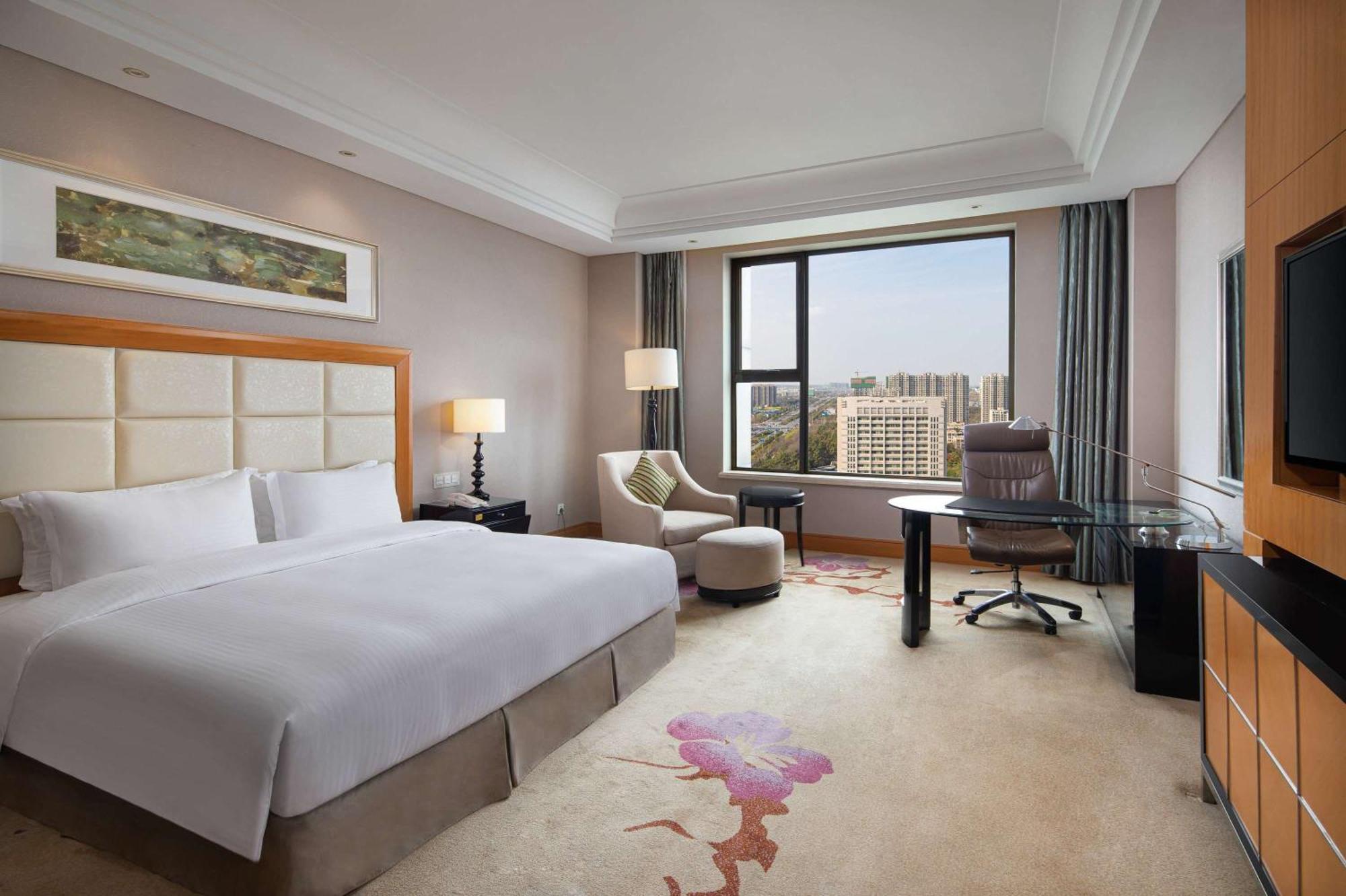 Hotel Wyndham Xinyang Downtown Exterior foto